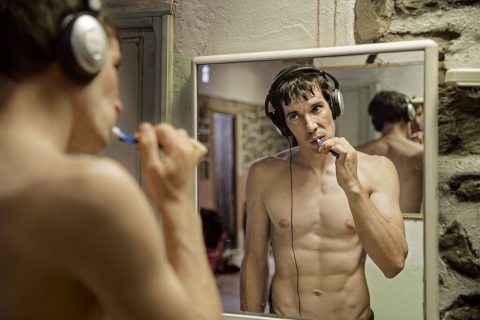 Honnold, 33, listens to music while brushing his teeth as he prepares for a day of climbing in Morocco’s High Atlas Mountains, one of several foreign locations where he trained for his attempt on El Capitan. (Jimmy Chin)